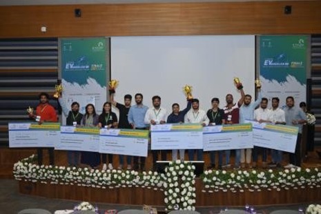 Winning teams on stage with trophies and cheques at the Evangelise finale